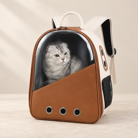 Caramel and cream pet carrier backpack with a clear window and ventilation holes.